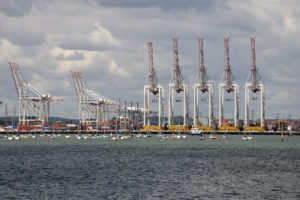 Container terminal cranes line a deepwater berth at DPWorld Southampton Port UK